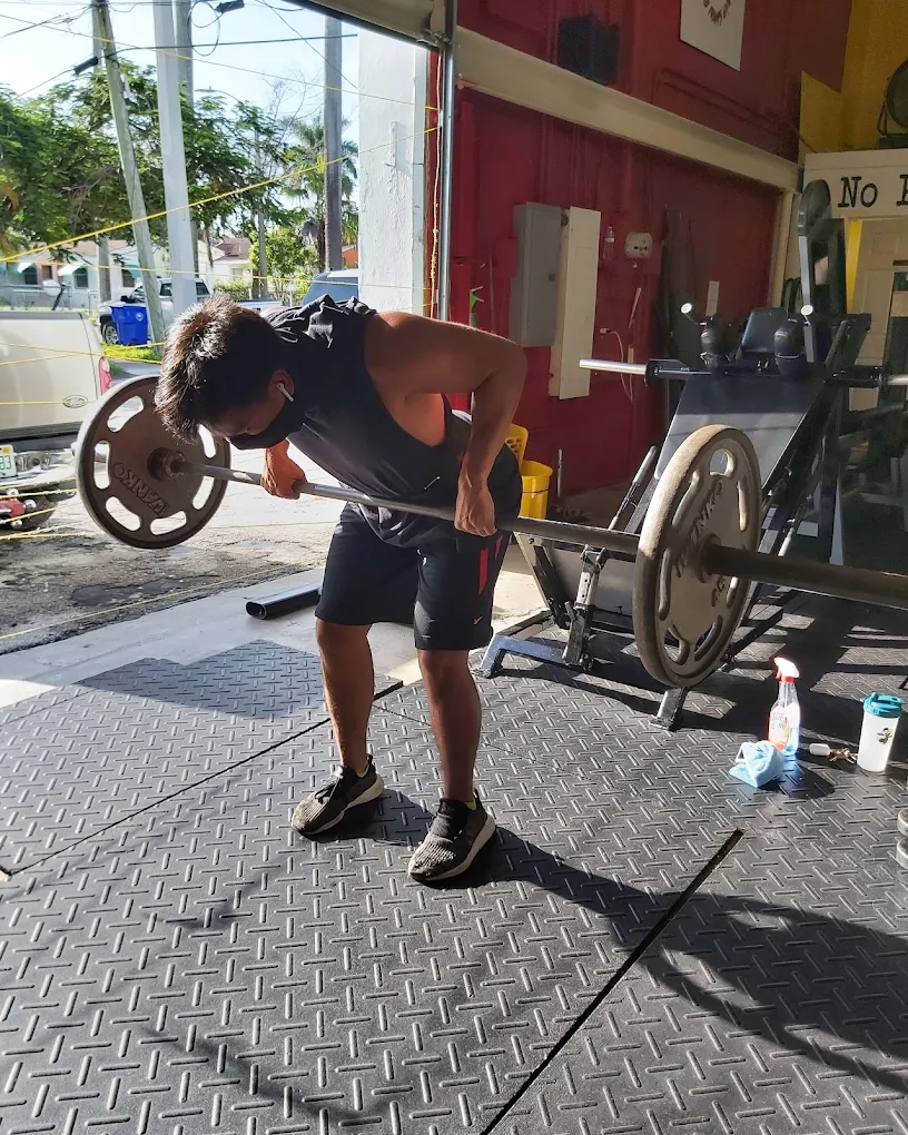 Heavy duty barbell training session at Iramis Gym